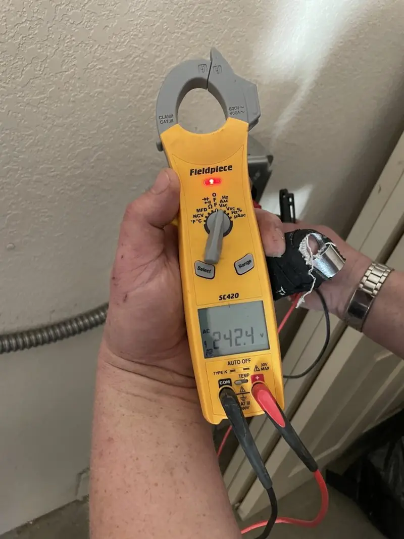 Voltage testing with clamp meter during Electrical Installation Services in Orangeville